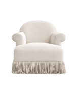 Grey armchair with tasselled fringe around the bottom of the chair, front view