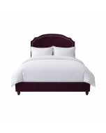 Elizabeth Bed in chutney velvet, wooden feet, styled with cream and charcoal cushions
