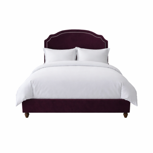 Elizabeth Bed in chutney velvet, wooden feet, styled with cream and charcoal cushions